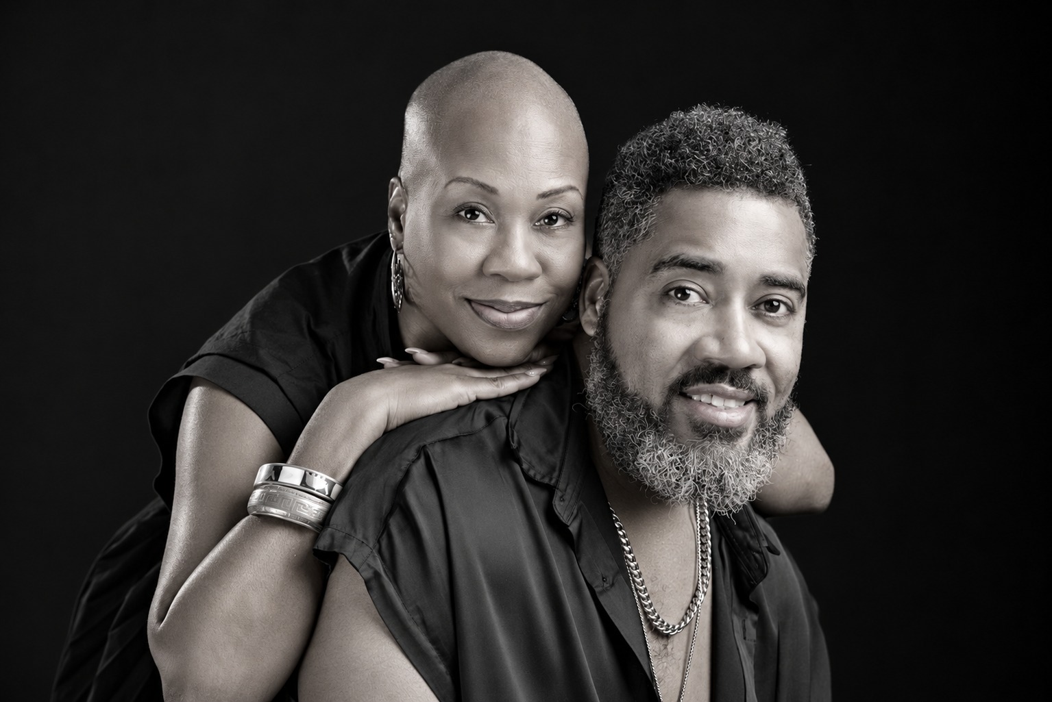 Black and white portrait of Dr. Milton Miller Jr. with a guest